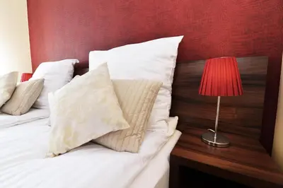 Łóżko lub łóżka w pokoju w obiekcie Hotel Pod Jeleniem