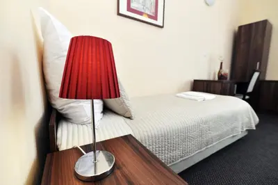 Łóżko lub łóżka w pokoju w obiekcie Hotel Pod Jeleniem
