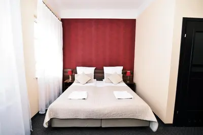 Łóżko lub łóżka w pokoju w obiekcie Hotel Pod Jeleniem