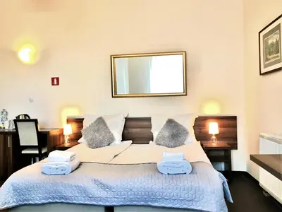 Łóżko lub łóżka w pokoju w obiekcie Hotel Pod Jeleniem