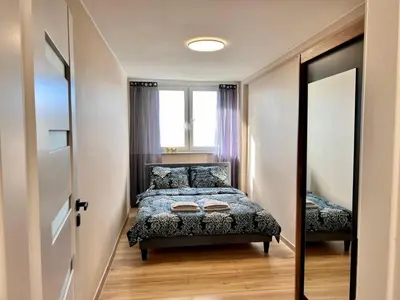 Łóżko lub łóżka w pokoju w obiekcie Apartament Piast