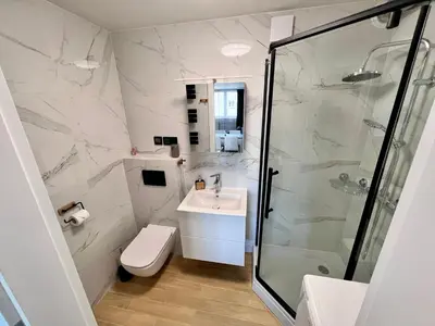 Łazienka w obiekcie Apartament Piast