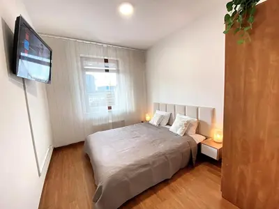 Łóżko lub łóżka w pokoju w obiekcie Apartimento Villa Prince Witold