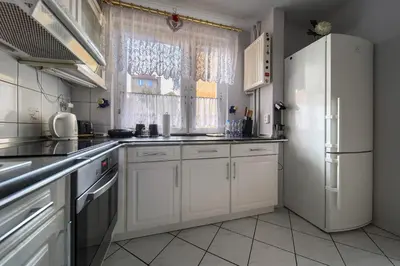 Kuchnia lub aneks kuchenny w obiekcie Szczepin Spacious Apartment by BookingHost