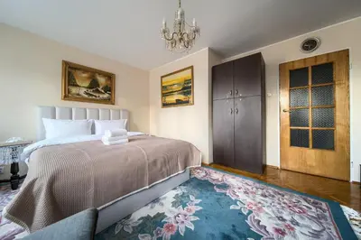 Łóżko lub łóżka w pokoju w obiekcie Szczepin Spacious Apartment by BookingHost