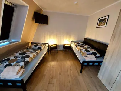 Łóżko lub łóżka w pokoju w obiekcie AE BERG Apartamenty