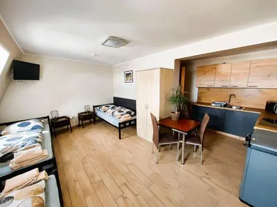 Łóżko lub łóżka w pokoju w obiekcie AE BERG Apartamenty