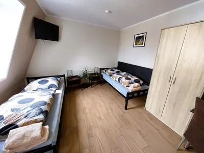 Łóżko lub łóżka w pokoju w obiekcie AE BERG Apartamenty