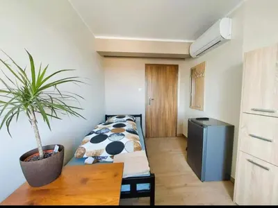 Łóżko lub łóżka w pokoju w obiekcie AE BERG Apartamenty