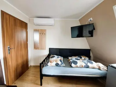 Łóżko lub łóżka w pokoju w obiekcie AE BERG Apartamenty