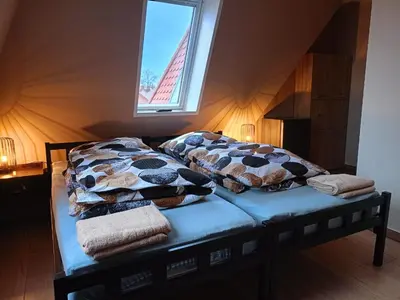 Łóżko lub łóżka w pokoju w obiekcie AE BERG Apartamenty