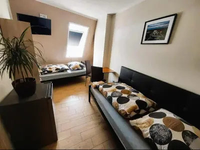 Łóżko lub łóżka w pokoju w obiekcie AE BERG Apartamenty