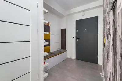 Łóżko lub łóżka w pokoju w obiekcie Zygmunta Starego 2-Bedroom Condo