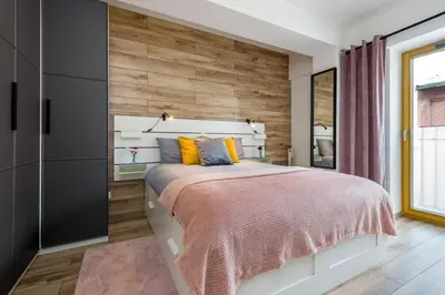 Łóżko lub łóżka w pokoju w obiekcie Zygmunta Starego 2-Bedroom Condo