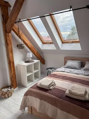 Łóżko lub łóżka w pokoju w obiekcie Gierymskiego Loft