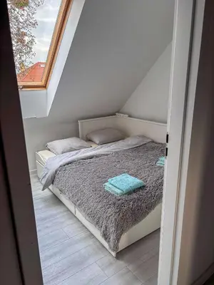 Łóżko lub łóżka w pokoju w obiekcie Gierymskiego Loft