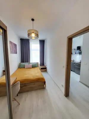 Łóżko lub łóżka w pokoju w obiekcie Apartament - Studio 2 Gliwice