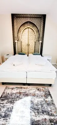 Łóżko lub łóżka w pokoju w obiekcie Apartamenty Castello Kamilla