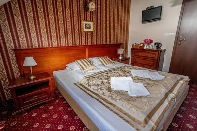 Łóżko lub łóżka w pokoju w obiekcie Resort Morawa