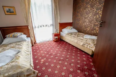 Łóżko lub łóżka w pokoju w obiekcie Resort Morawa