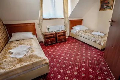 Łóżko lub łóżka w pokoju w obiekcie Resort Morawa