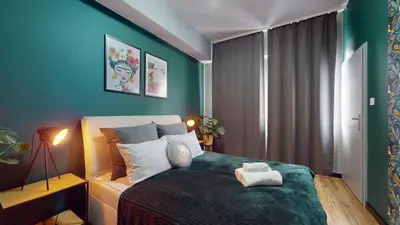 Łóżko lub łóżka w pokoju w obiekcie Aparthotel Market Square TectumApartments