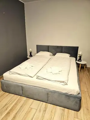 Łóżko lub łóżka w pokoju w obiekcie Cozy apartment 5 min walk from Rynek square