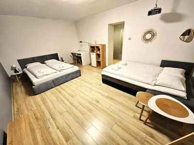 Łóżko lub łóżka w pokoju w obiekcie Cozy apartment 5 min walk from Rynek square