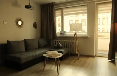 Część wypoczynkowa w obiekcie Cozy apartment 5 min walk from Rynek square