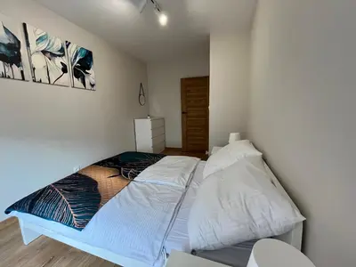 Łóżko lub łóżka w pokoju w obiekcie Apartament 40