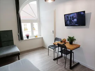 Telewizja i/lub zestaw kina domowego w obiekcie Pokoje Pod Pałacem