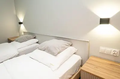 Łóżko lub łóżka w pokoju w obiekcie Apartamenty Castello