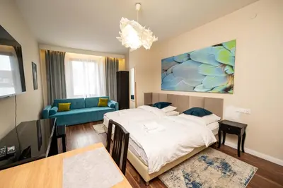 Łóżko lub łóżka w pokoju w obiekcie Apartamenty Castello