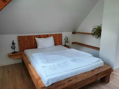 Łóżko lub łóżka w pokoju w obiekcie Apartamenty Dom Zielony