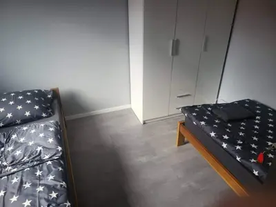 Łóżko lub łóżka w pokoju w obiekcie Noclegi Bielawa