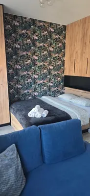 Łóżko lub łóżka w pokoju w obiekcie Pomorska Apartment
