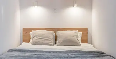 Łóżko lub łóżka w pokoju w obiekcie Apartamenty Jaworska 4 - ProperUNIT