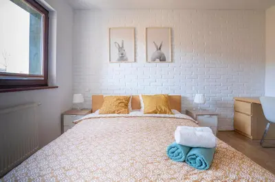 Łóżko lub łóżka w pokoju w obiekcie Apartament Werona Check-in 24h AirCon Privat Parking