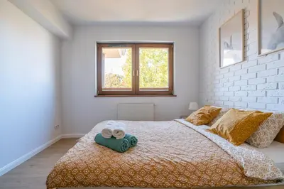 Łóżko lub łóżka w pokoju w obiekcie Apartament Werona Check-in 24h AirCon Privat Parking