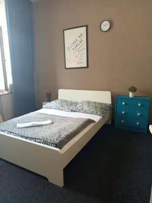 Łóżko lub łóżka w pokoju w obiekcie Rooms Center - dworzec PKP, rynek Wrocław