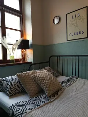 Łóżko lub łóżka w pokoju w obiekcie Rooms Center - dworzec PKP, rynek Wrocław