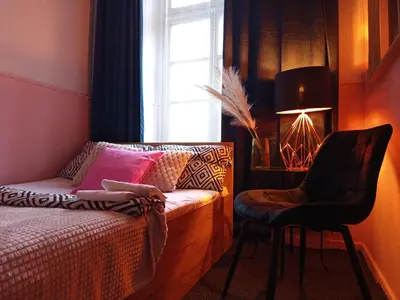 Łóżko lub łóżka w pokoju w obiekcie Rooms Center - dworzec PKP, rynek Wrocław