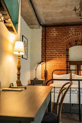 Łóżko lub łóżka w pokoju w obiekcie ARCHE Klasztor Wrocław