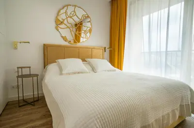 Łóżko lub łóżka w pokoju w obiekcie Boulevard Drobnera IV - Apartament nad Odrą - Rynek