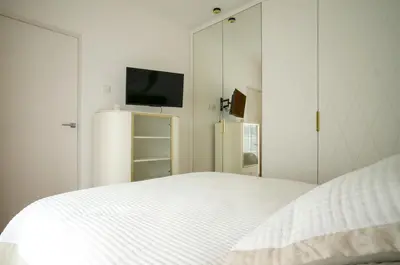 Łóżko lub łóżka w pokoju w obiekcie Boulevard Drobnera IV - Apartament nad Odrą - Rynek