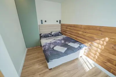 Łóżko lub łóżka w pokoju w obiekcie Apartamenty Alegrima