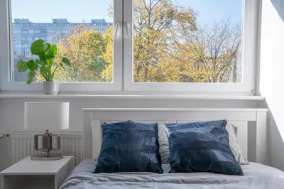 Łóżko lub łóżka w pokoju w obiekcie Apartament Flower Check In 24H