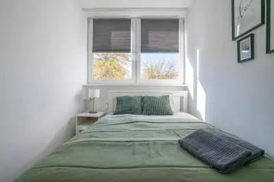 Łóżko lub łóżka w pokoju w obiekcie Apartament Flower Check In 24H