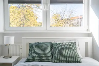 Łóżko lub łóżka w pokoju w obiekcie Apartament Flower Check In 24H