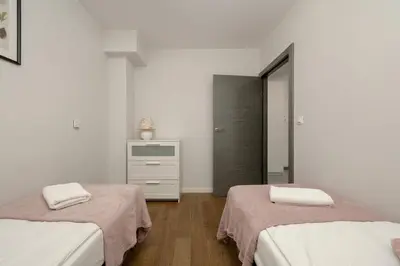 Łóżko lub łóżka w pokoju w obiekcie Kukuczki 7 Stylowy Apartament we Wrocławiu by Noclegi Renters